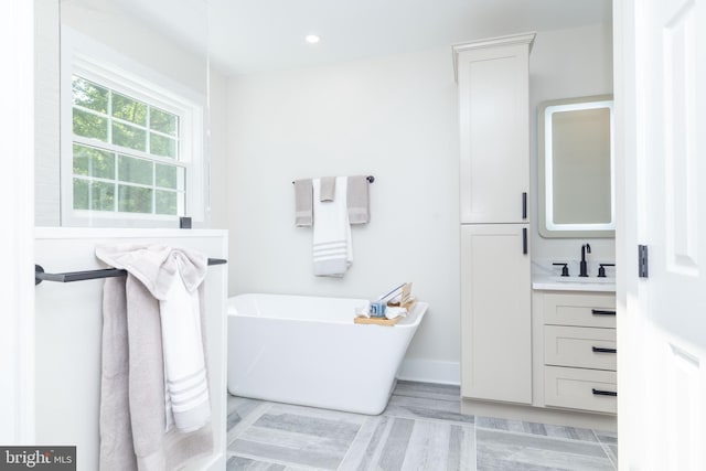 17 Bridleshire Rd, Newark, DE 19711 - full bathroom with a soaking tub, vanity, and recessed lighting