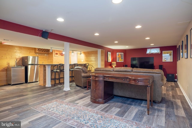 17 Bridleshire Rd, Newark, DE 19711 - living room with wood finished floors, recessed lighting, wooden walls, baseboards, and bar