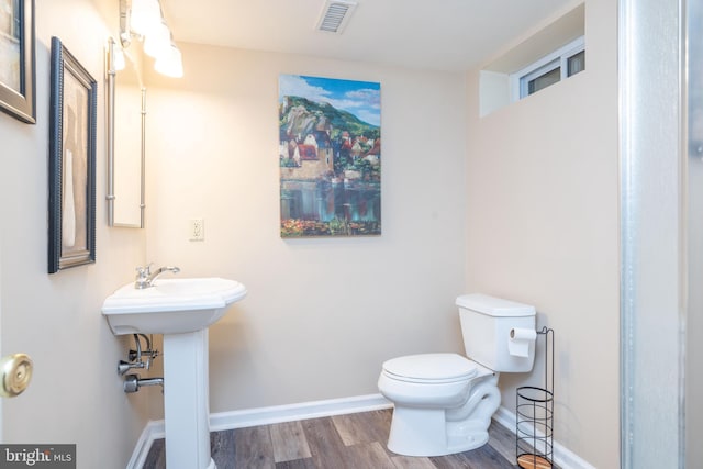 17 Bridleshire Rd, Newark, DE 19711 - bathroom with toilet, wood finished floors, baseboards, and a sink