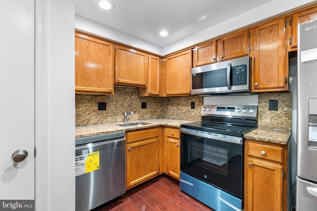 9 Alpen Green Ct Unit 20-208, Burtonsville, MD 20866 - kitchen with appliances with stainless steel finishes, dark wood finished floors, backsplash, a sink, and light stone counters