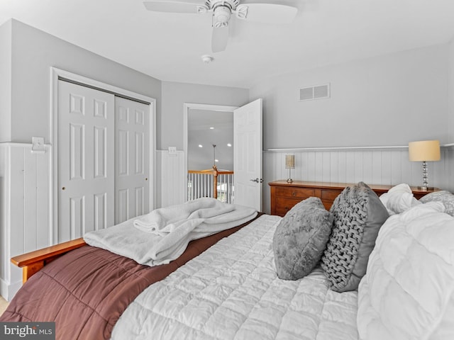 928 Township Line Rd, Chalfont, PA 18914 - bedroom with a wainscoted wall, ceiling fan, and a closet