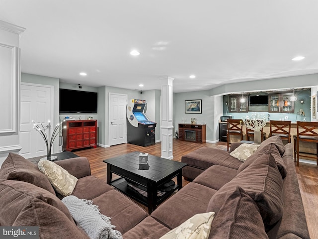 928 Township Line Rd, Chalfont, PA 18914 - living area featuring decorative columns, recessed lighting, and wood finished floors