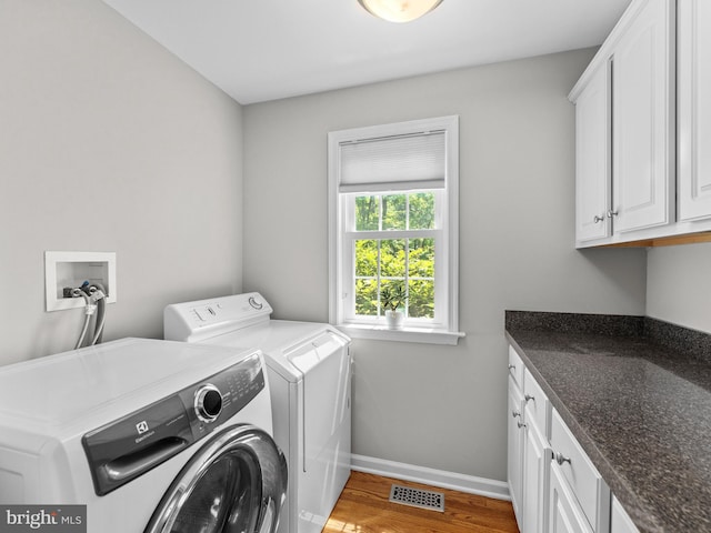 928 Township Line Rd, Chalfont, PA 18914 - washroom with cabinet space, washing machine and dryer, and wood finished floors