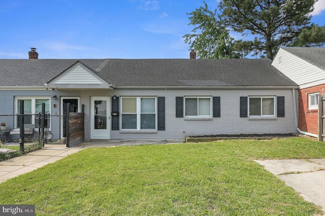 323 Sheridan Dr, New Castle, DE 19720 - view of front of property featuring a chimney, brick siding, and a shingled roof