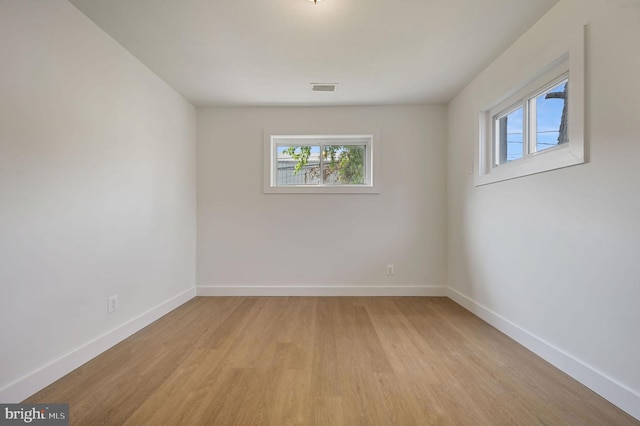 323 Sheridan Dr, New Castle, DE 19720 - unfurnished room with light wood-style floors, healthy amount of natural light, and baseboards