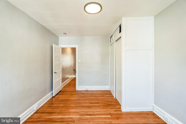 1004 N 67th St, Philadelphia, PA 19151 - unfurnished bedroom featuring a closet, light wood-style flooring, and baseboards