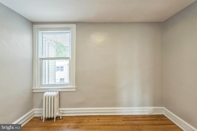 1004 N 67th St, Philadelphia, PA 19151 - spare room featuring radiator, wood finished floors, and baseboards