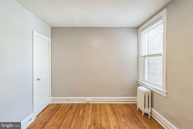 1004 N 67th St, Philadelphia, PA 19151 - unfurnished room featuring radiator heating unit, light wood finished floors, and baseboards