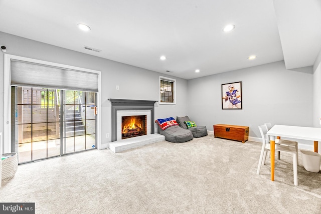 31 Tudor Ct, Lutherville Timonium, MD 21093 - rec room with carpet flooring, healthy amount of natural light, a lit fireplace, and recessed lighting