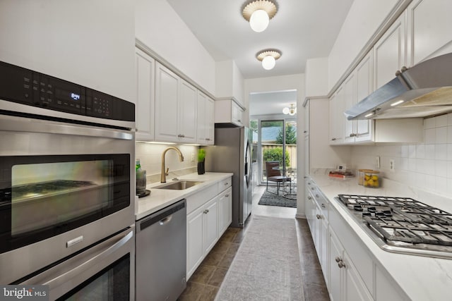 6 Roland Mews Unit R46, Baltimore, MD 21210 - kitchen featuring stainless steel appliances, a sink, tasteful backsplash, and light countertops