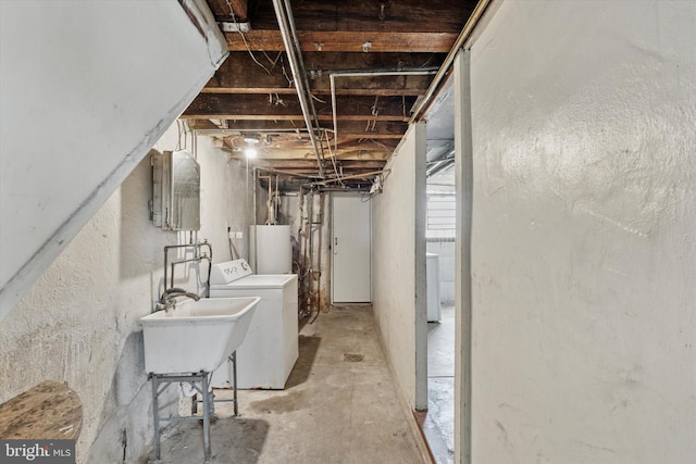 1500 Benner St, Philadelphia, PA 19149 - unfinished below grade area with water heater, a sink, and washing machine and dryer