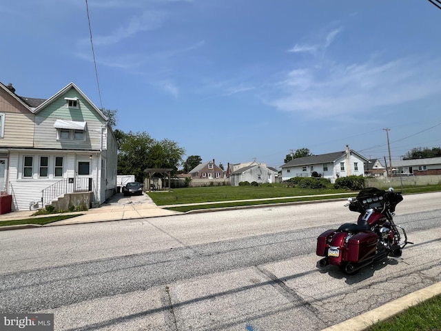 234 Erickson Ave Unit 28-31, Essington, PA 19029 - view of asphalt street featuring sidewalks, a residential view, and curbs