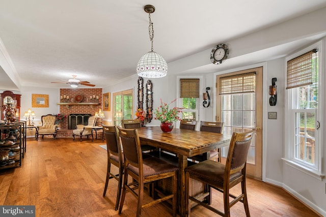 175 Mt Hope Church Rd, Stafford, VA 22554 - dining space with a fireplace, light wood-style floors, and ceiling fan