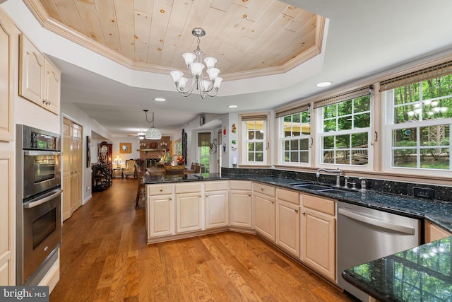 175 Mt Hope Church Rd, Stafford, VA 22554 - kitchen featuring stainless steel appliances, a raised ceiling, ornamental molding, a chandelier, and light wood finished floors