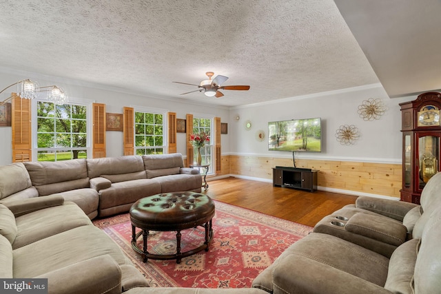 175 Mt Hope Church Rd, Stafford, VA 22554 - living room with wainscoting, wood finished floors, a ceiling fan, ornamental molding, and a textured ceiling