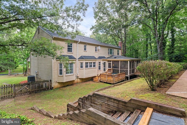 175 Mt Hope Church Rd, Stafford, VA 22554 - back of property featuring a sunroom, a wooden deck, a shingled roof, and a chimney