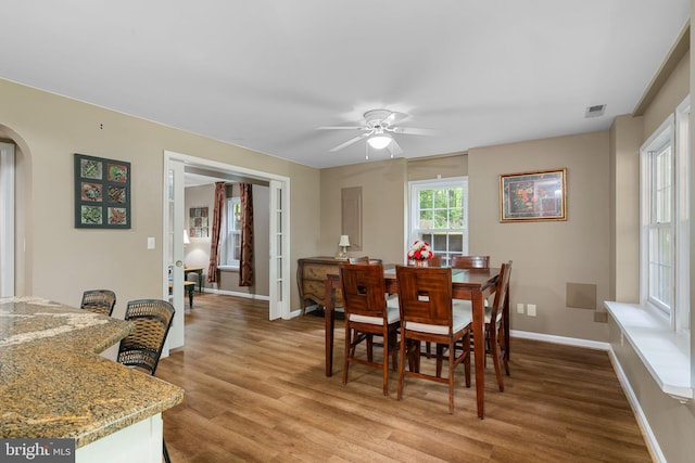 175 Mt Hope Church Rd, Stafford, VA 22554 - dining room with arched walkways, a ceiling fan, and wood finished floors