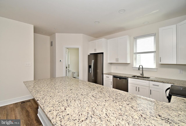 287 Yards Ct, Hatboro, PA 19040 - kitchen featuring stainless steel appliances, a sink, dark wood-style flooring, white cabinetry, and light stone countertops