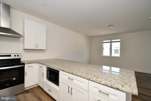 287 Yards Ct, Hatboro, PA 19040 - kitchen featuring electric stove, black microwave, wall chimney exhaust hood, a peninsula, and dark wood-style flooring