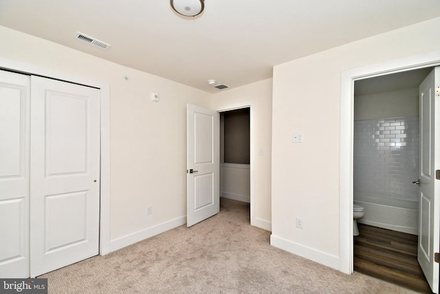 287 Yards Ct, Hatboro, PA 19040 - unfurnished bedroom with baseboards, a closet, light carpet, and connected bathroom