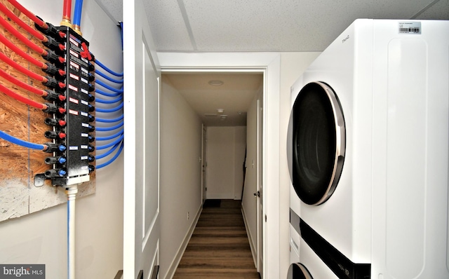287 Yards Ct, Hatboro, PA 19040 - laundry room with stacked washer / dryer, wood finished floors, and baseboards