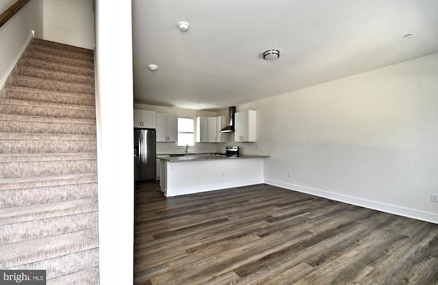 287 Yards Ct, Hatboro, PA 19040 - kitchen with appliances with stainless steel finishes, wall chimney exhaust hood, a peninsula, and dark wood-style floors