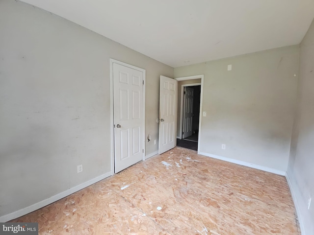 239 Grove St, Bridgeton, NJ 08302 - unfurnished bedroom featuring baseboards