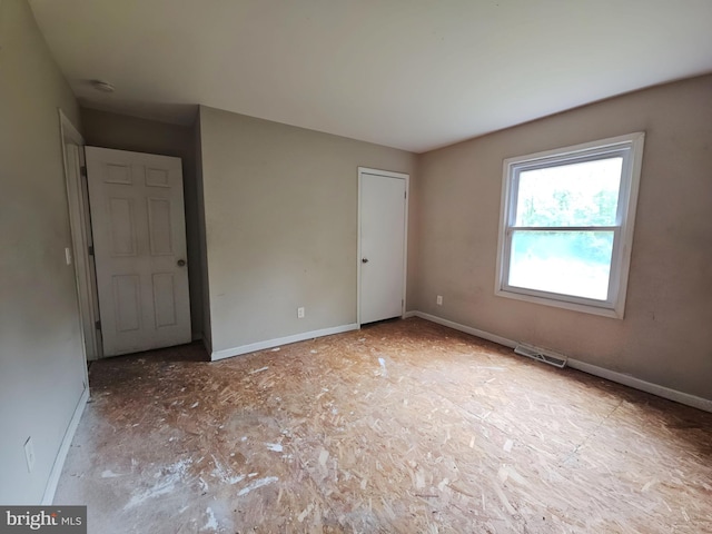 239 Grove St, Bridgeton, NJ 08302 - unfurnished bedroom featuring baseboards