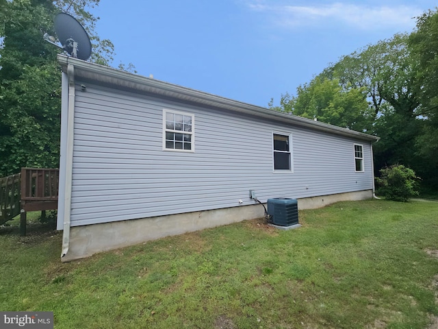 239 Grove St, Bridgeton, NJ 08302 - view of side of property with central air condition unit and a yard