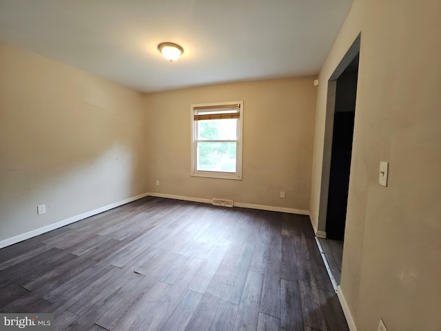 239 Grove St, Bridgeton, NJ 08302 - empty room with dark wood-type flooring and baseboards