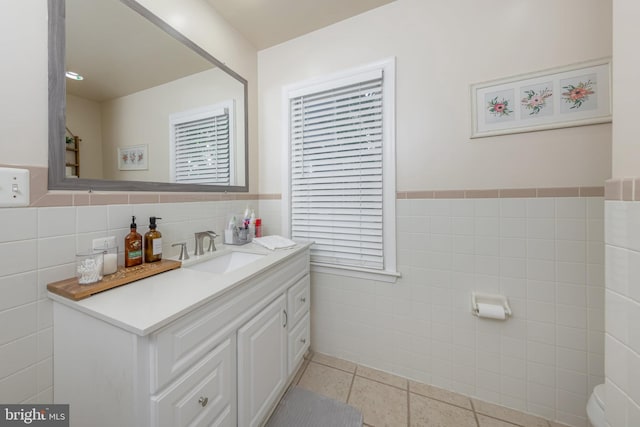 42 Lupton Ave, Woodbury, NJ 08096 - bathroom with tile walls, vanity, a wainscoted wall, and tile patterned floors