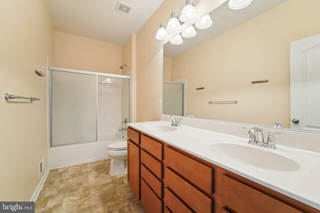 7912 Meridian Dr, Pasadena, MD 21122 - bathroom featuring double vanity and shower / bath combination with glass door