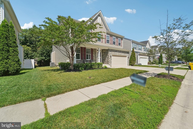 7912 Meridian Dr, Pasadena, MD 21122 - view of front of property featuring stone siding, concrete driveway, an attached garage, and a front lawn