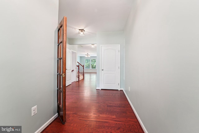 7912 Meridian Dr, Pasadena, MD 21122 - hall with dark wood finished floors and stairway