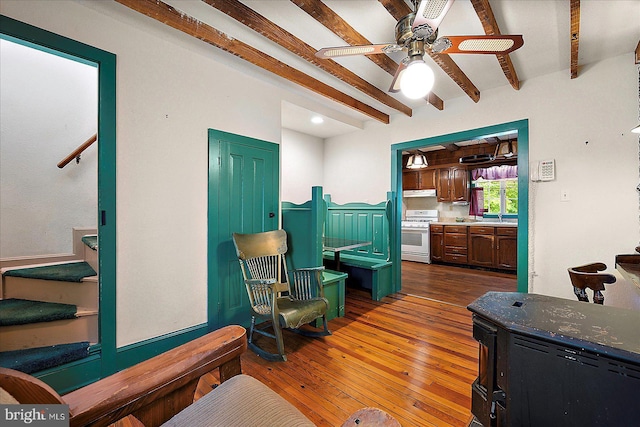 13220 Bank St, Bishopville, MD 21813 - living room with stairs, beam ceiling, hardwood / wood-style floors, and a ceiling fan