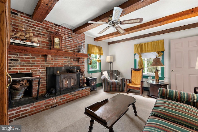 13220 Bank St, Bishopville, MD 21813 - carpeted living room with beam ceiling, ceiling fan, and a wood stove