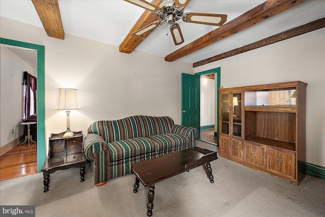 13220 Bank St, Bishopville, MD 21813 - living room with ceiling fan, baseboards, beamed ceiling, and carpet flooring