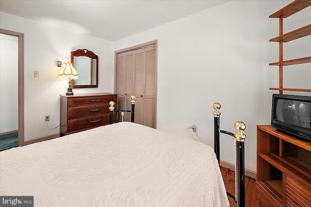 13220 Bank St, Bishopville, MD 21813 - bedroom featuring baseboards, a closet, and wood finished floors