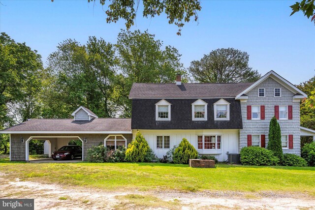 13220 Bank St, Bishopville, MD 21813 - view of front of house with cooling unit, a front yard, a chimney, roof with shingles, and driveway