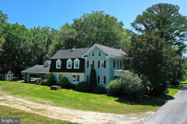 13220 Bank St, Bishopville, MD 21813 - view of front of house with dirt driveway, a front lawn, a chimney, and roof with shingles