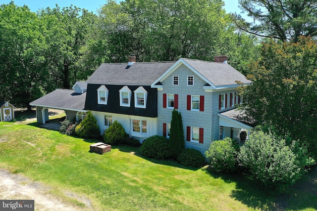 13220 Bank St, Bishopville, MD 21813 - view of front of home with a chimney, a front yard, and a shingled roof