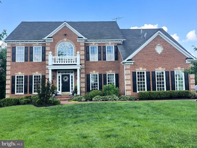 14300 Dowden Downs Dr, Haymarket, VA 20169 - colonial-style house with a front lawn and brick siding