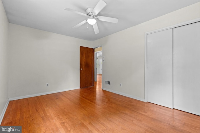 3415 E Market St, York, PA 17402 - unfurnished bedroom featuring wood finished floors, baseboards, a closet, and ceiling fan