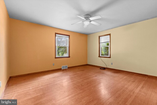 3415 E Market St, York, PA 17402 - spare room with a ceiling fan, light wood finished floors, and baseboards