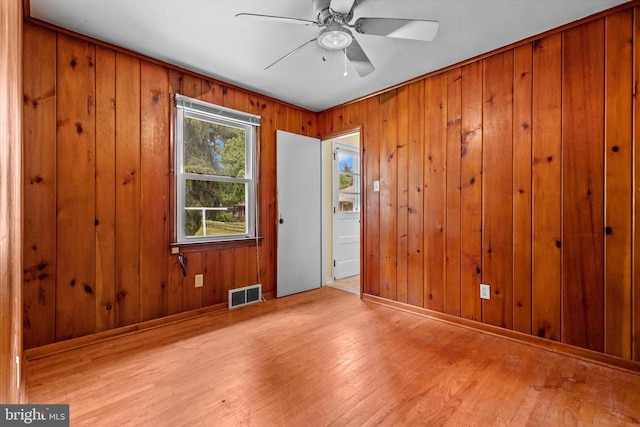3415 E Market St, York, PA 17402 - unfurnished room with ceiling fan, wood finished floors, wood walls, and baseboards