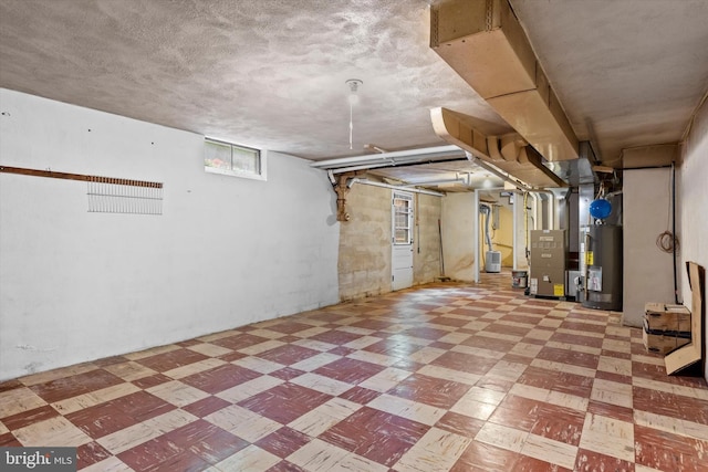 3415 E Market St, York, PA 17402 - basement featuring tile patterned floors, water heater, and heating unit