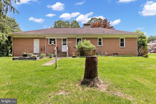 3415 E Market St, York, PA 17402 - view of front of home featuring entry steps, a front yard, and brick siding