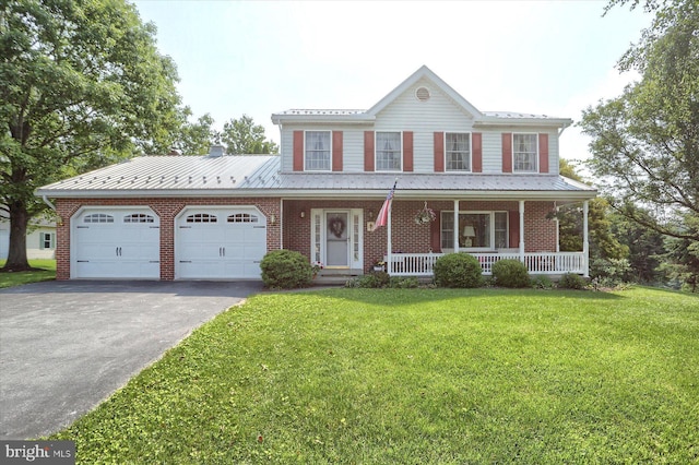 74 Acker Rd, Newport, PA 17074 - view of front of property featuring a garage, asphalt driveway, brick siding, a porch, and a front lawn