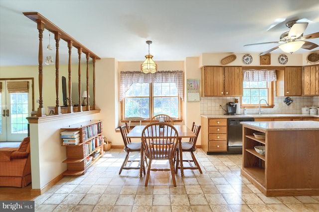 74 Acker Rd, Newport, PA 17074 - kitchen featuring dishwasher, decorative backsplash, brown cabinets, and baseboards