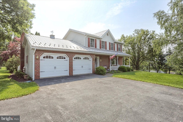74 Acker Rd, Newport, PA 17074 - view of front facade featuring a garage, asphalt driveway, covered porch, a front lawn, and brick siding